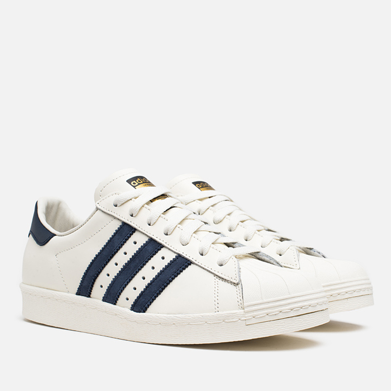 White and navy blue adidas superstar top
